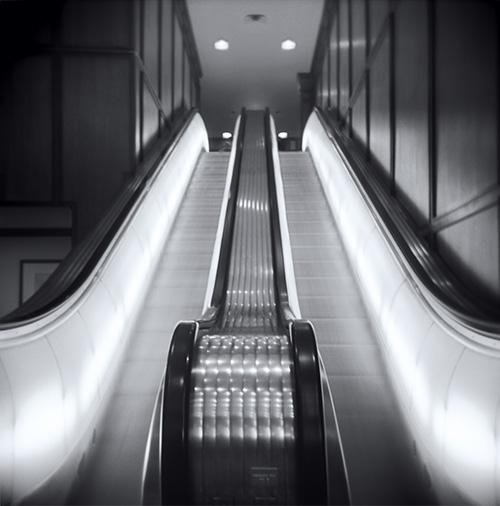 Brown Palace: Escalator black and white photo